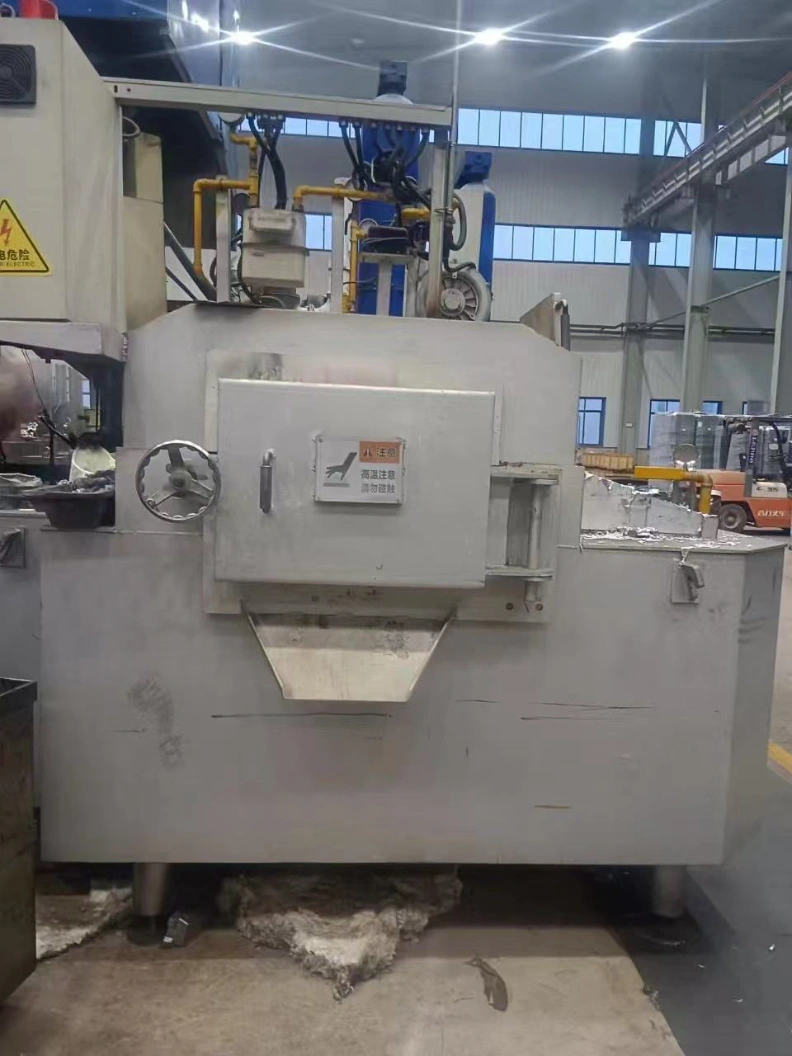 Front view of Huirong crucible-less holding furnace installed beside die casting machine in foundry workshop